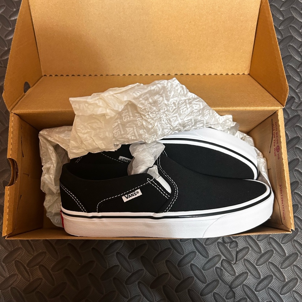 Vans Women's Black and White Slip-On Sneakers
